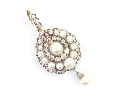 An early 20th century diamond and 'pearl' pendant or brooch, the central 'pearl' surrounded by eleven mixed cut diamonds, and