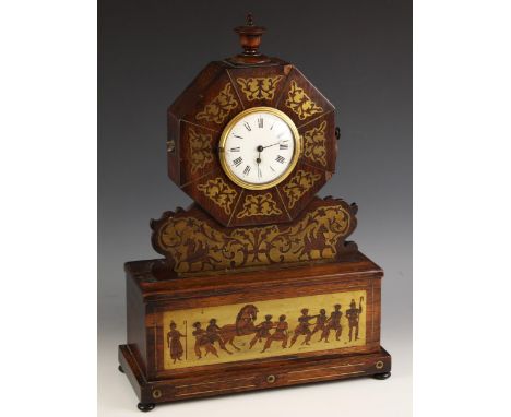 A rosewood and brass inlaid mantel timepiece, mid 19th century, the octagonal case with applied ring handles, enclosing the 1