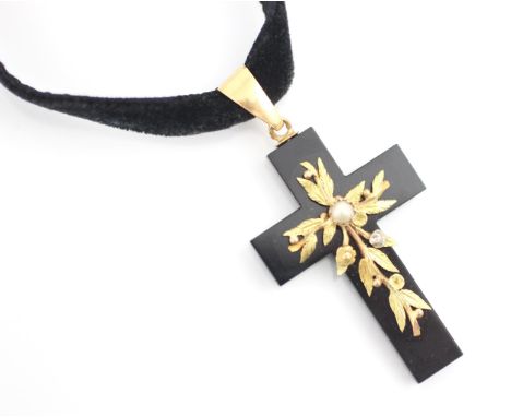 A 19th century style cross pendant, the black glass cross with applied two tone yellow metal leaf design with 'pearl' detail,