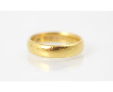 A 22ct yellow gold wedding band, stamped 'HA' Birmingham 1917, ring size M, 6gms