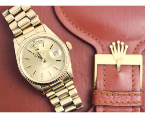 A gentleman's 18ct gold Rolex Oyster Perpetual Day-Date wristwatch, the round gold-toned dial with baton markers with day and