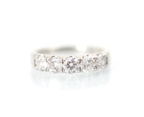 A Mappin &amp; Webb platinum five stone diamond ring, the five round cut diamonds claw set within a platinum plain polished s