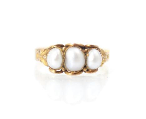 A 19th century untested pearl ring, the three baroque shaped pearls within scalloped yellow metal edge leading to engraved an