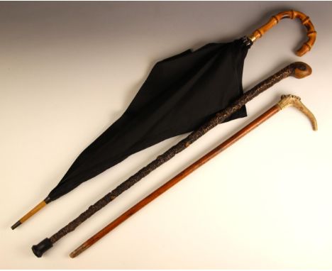 A Victorian ‘18ct’ collared parasol, stamped '18ct gp' 90cm high, with an antler handled crop, 67.5cm high, and a Japanese gn