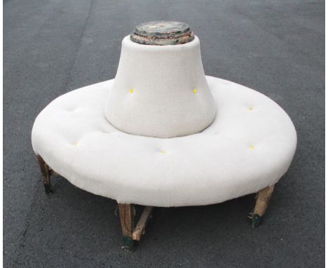 A French salon courting/confident seat, mid 19th century, of upholstered ring form with a central bell shaped drop-in back re