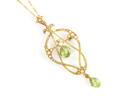 A 20th century peridot and split pearl pedant/brooch, the central oval cut peridot within sinuous yellow metal pendant set wi