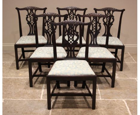 A set of eight mahogany Chippendale revival dining chairs, late 19th century, each chair with a foliate swept top rail over a