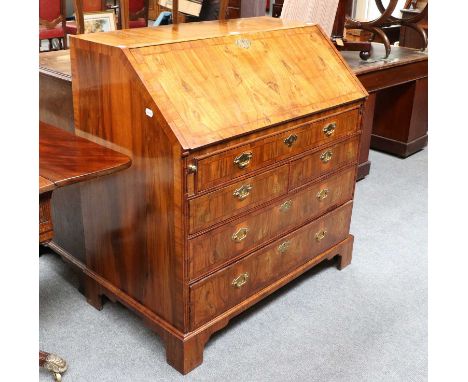An 18th Century Cross and Feather Banded Walnut Bureau, with fully fitted interior, arrangement of five drawers below, bracke