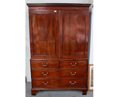 A George III Mahogany Linen Press, converted for hanging, dentil moulded cornice over twindoors, two short and two long drawe