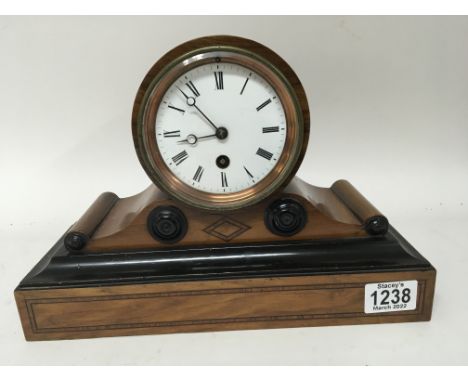 An inlaid walnut mantel clock with a white enamel dial fitted with a French movement with pendulum. Length 30cm - NO RESERVE