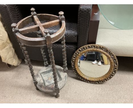 An oak stick stand and a circular gilt mirror, no reserve.
