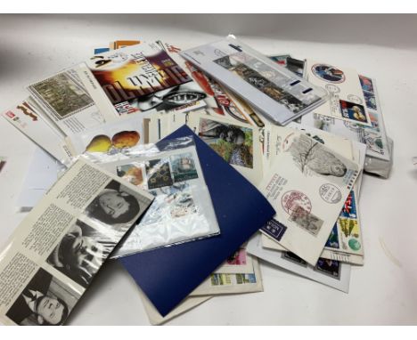 A box of channel island stamps and some first day covers.