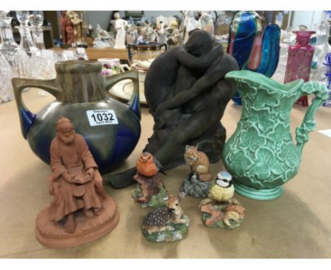A collection of ceramic items including an embracing couple, a green Sylvia jug, a twin handled drip glaze jug, an Italian se