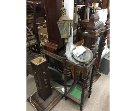 A mahogany wall clock for restoration together with a lantern, standard lamp, stick stand and a folding table with brass top 