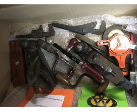 A box containing tools and a Tilly lamp .