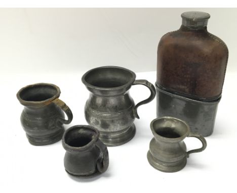 Four antique small pewter measures and a vintage pewter and leather hip flask. No reserve.