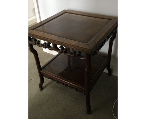 An Early 20th century Chinese hardwood occasional table the square top on shaped supports.