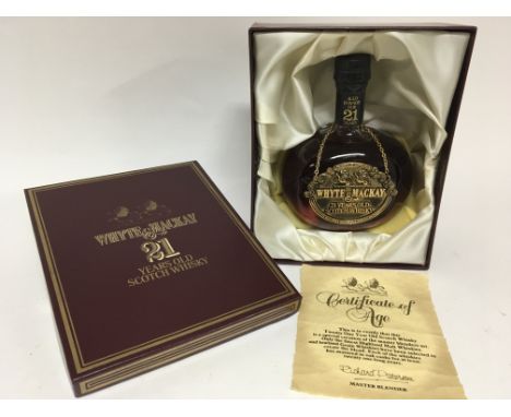 A boxed bottle of 21 year old Whyte &amp; Mackay master blend Scotch Whisky.