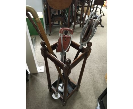 A stick stand together with gun sticks and walking sticks.