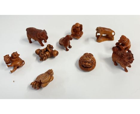 10 carved fruitwood netsuke.