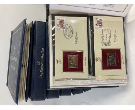 7 albums of 22ct gold replica British stamp first day covers.