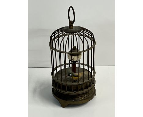 A miniature replica automaton birdcage clock.