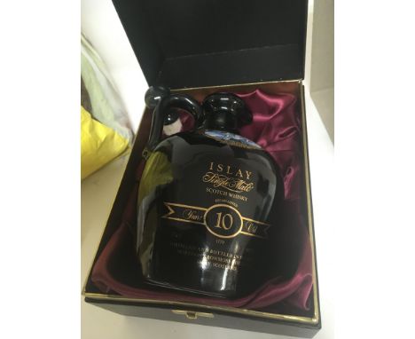 A limited edition presentation bottle of 10 year old Bowmore Islay Single Malt Whisky presented in a well sealed and excellen