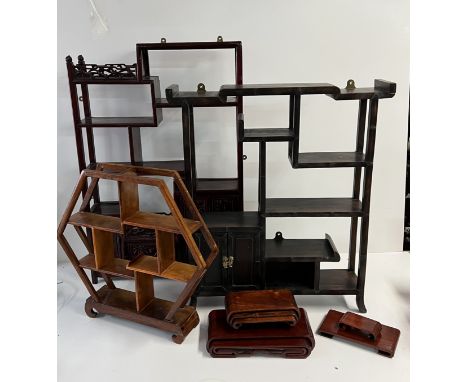 A mixed lot of Chinese hardwood display stands and small shelf units.