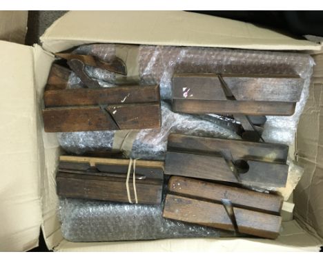 Five boxes containing wooden working tools moulding planes various.