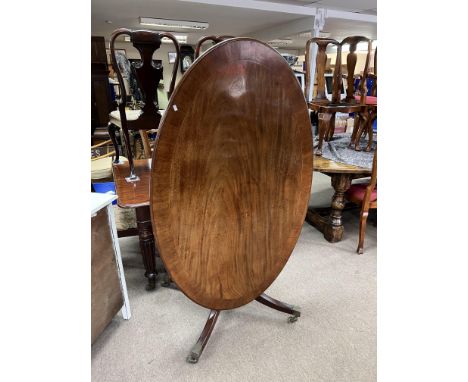 A mahogany tilt topped oval breakfast table - NO RESERVE