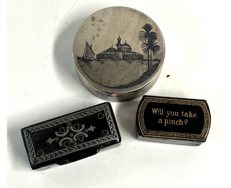 A white metal niello decorated patch box together with 2 papier-mÃ¢chÃ© snuff boxes.