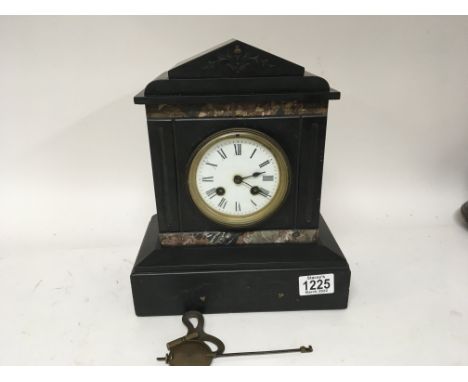 A black slate and Marble Victorian clock fitted with a French movement with key and pendulum. Hight 29cm - NO RESERVE