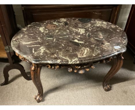 An Italian marble topped table with carved wooded base. 84 x 58cm x 48cm