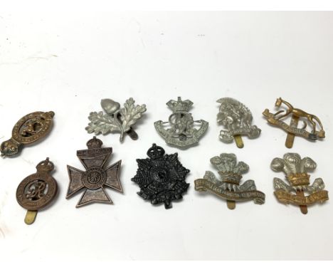 10 British Army cap badges.