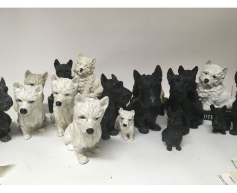 A collection of painted metal and ceramic painted black and white Scotty dog figures including Black and White Whisky adverti