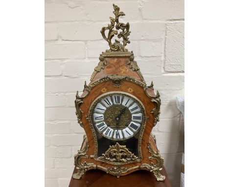A French style marquetry clock. No reserve.