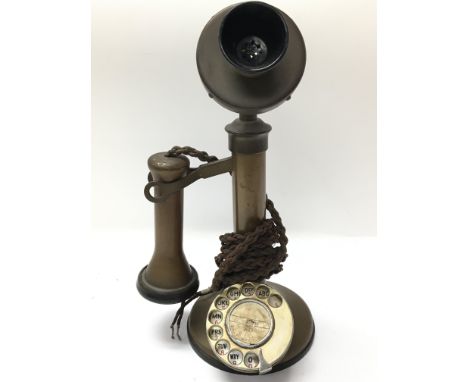 A 1920s original stick telephone with original cord.