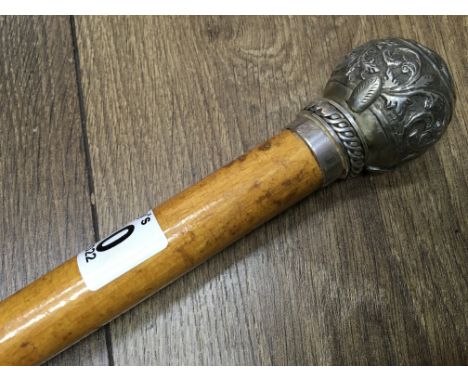 An Edwardian walking stick with silver topped handle