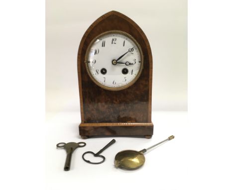 A rare Lenzkirch burr walnut mantel clock in lancet shape, seen working. Comes with pendulum, original and replacement keys. 