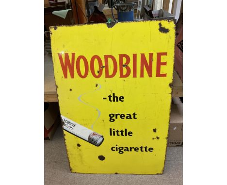 A vintage enamel sign advertising Woodbrine cigarettes. Measuring approximately 61cm x 91cm.