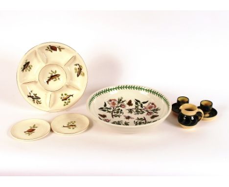 A pair of Holkham Pottery egg cups, and matching baluster cream jug; a Portmeirion "Botanic Garden" patterned fruit bowl; a f