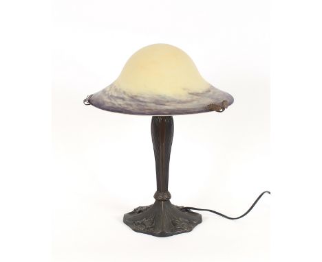 A Tiffany design bronzed effect table lamp, with opaque glass domed shade