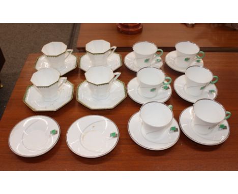 Six Shelly Art Deco tea cups and saucers; two further saucers; and four Wedgwood teacups and saucers - some damage