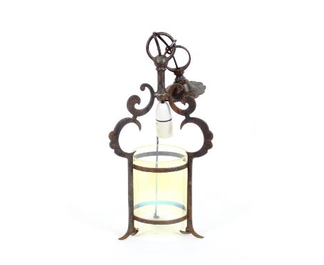 An Arts &amp; Crafts style wrought iron hanging hall lamp, with tinted glass shade, 42cm high
