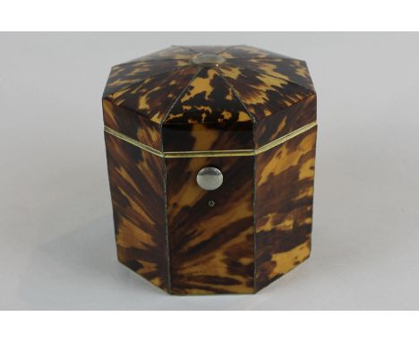 A George III octagonal blonde tortoiseshell tea caddy with hinged top and 'metal line' divisions with interior lift-out cover