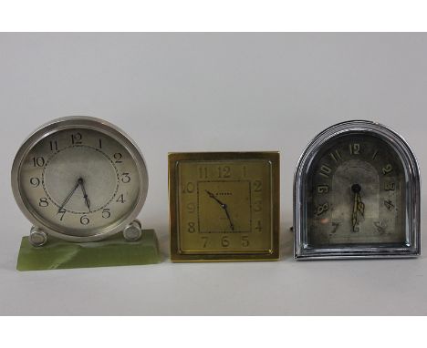 A gilt cased mantel clock, an Estyma 'Year' clock, a Genalex electric mantel clock (lead required) and a small mantel clock