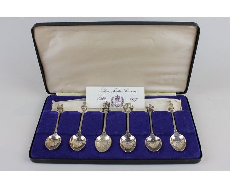 A set of six silver spoons, 'Queen's Silver Jubilee 1952-1977' each with a different 'royal item' capital, 2.5oz, (cased)