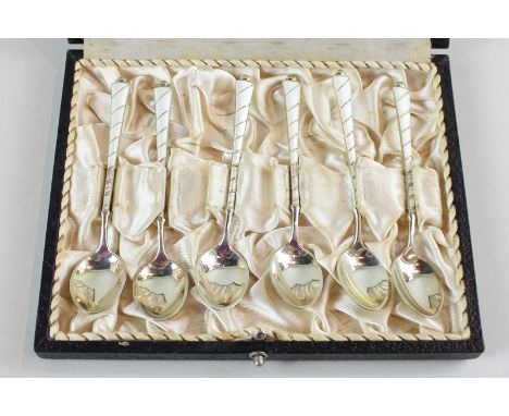 A set of six Danish silver coffee spoons with white enamel handles