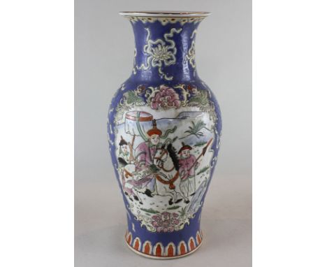 A  Chinese porcelain vase, blue ground with two panels of figures, decorated with prunus, seal mark to base, 36cm