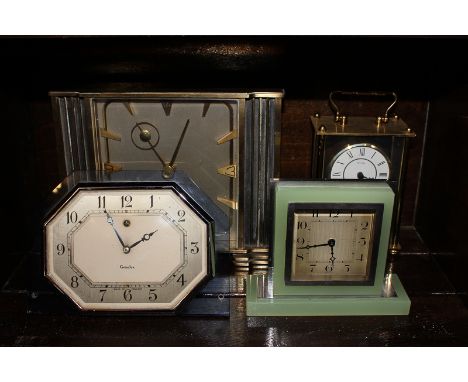A Eterna gilt cased travelling clock with easel back and Arabic numerals, with eight-day movement, together with another chro